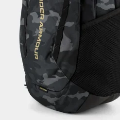 UA HUSTLE 6.0- ZAINI BLACK/METALLIC GOLD 1384672