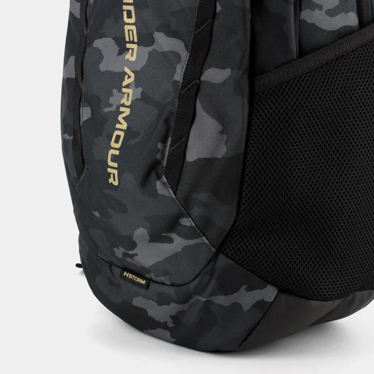 UA HUSTLE 6.0- ZAINI BLACK/METALLIC GOLD 1384672